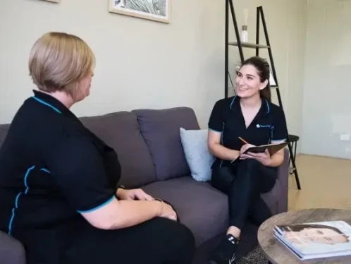 clean feeling employees having a catch up on a couch