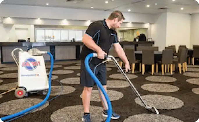 commercial cleaner from clean feeling vaccuming a restaurant